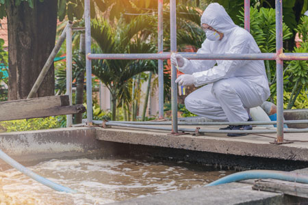 USP employee testing wastewater